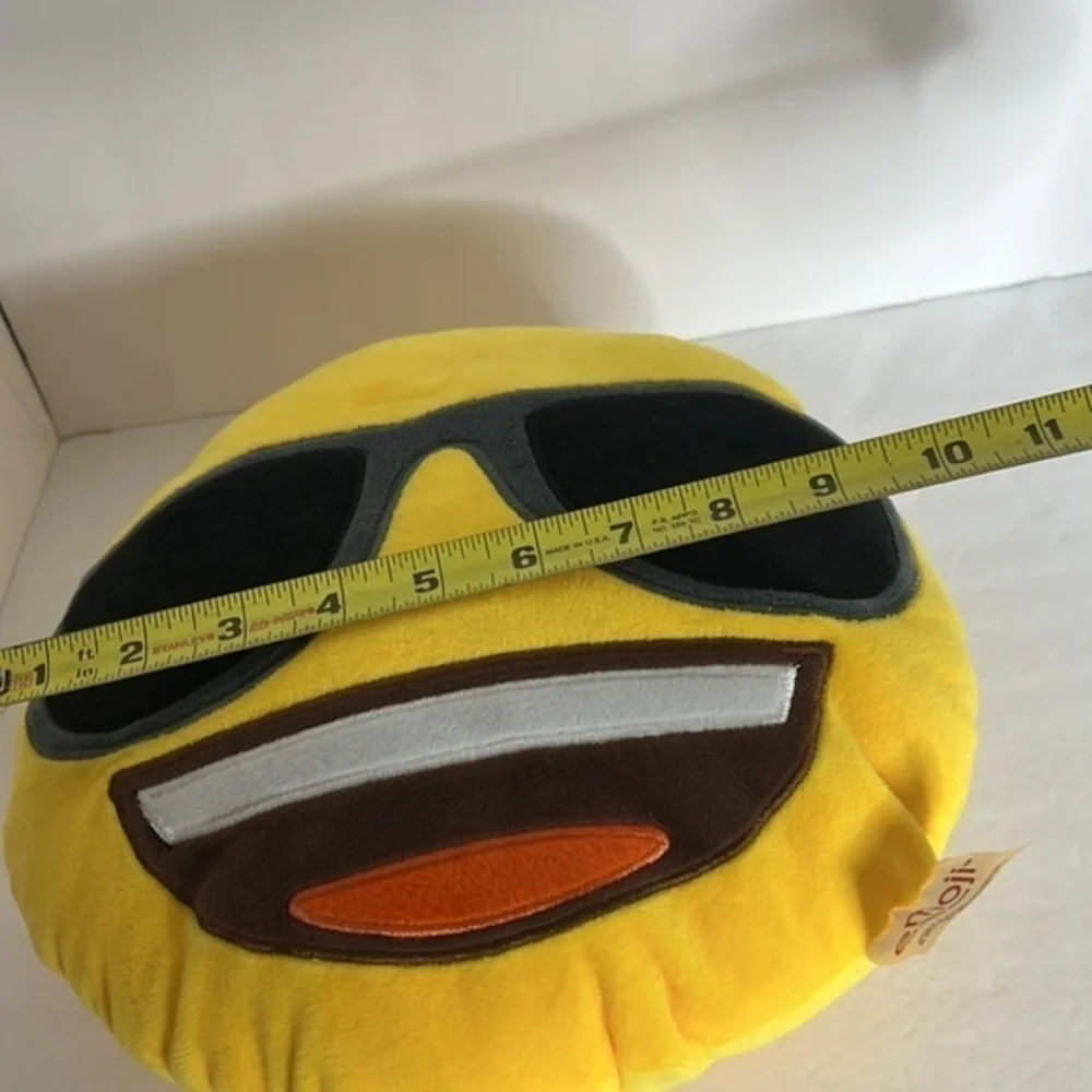 THE ICONIC BRAND EMOJI SMILE PILLOW WITH SUNGLASSES